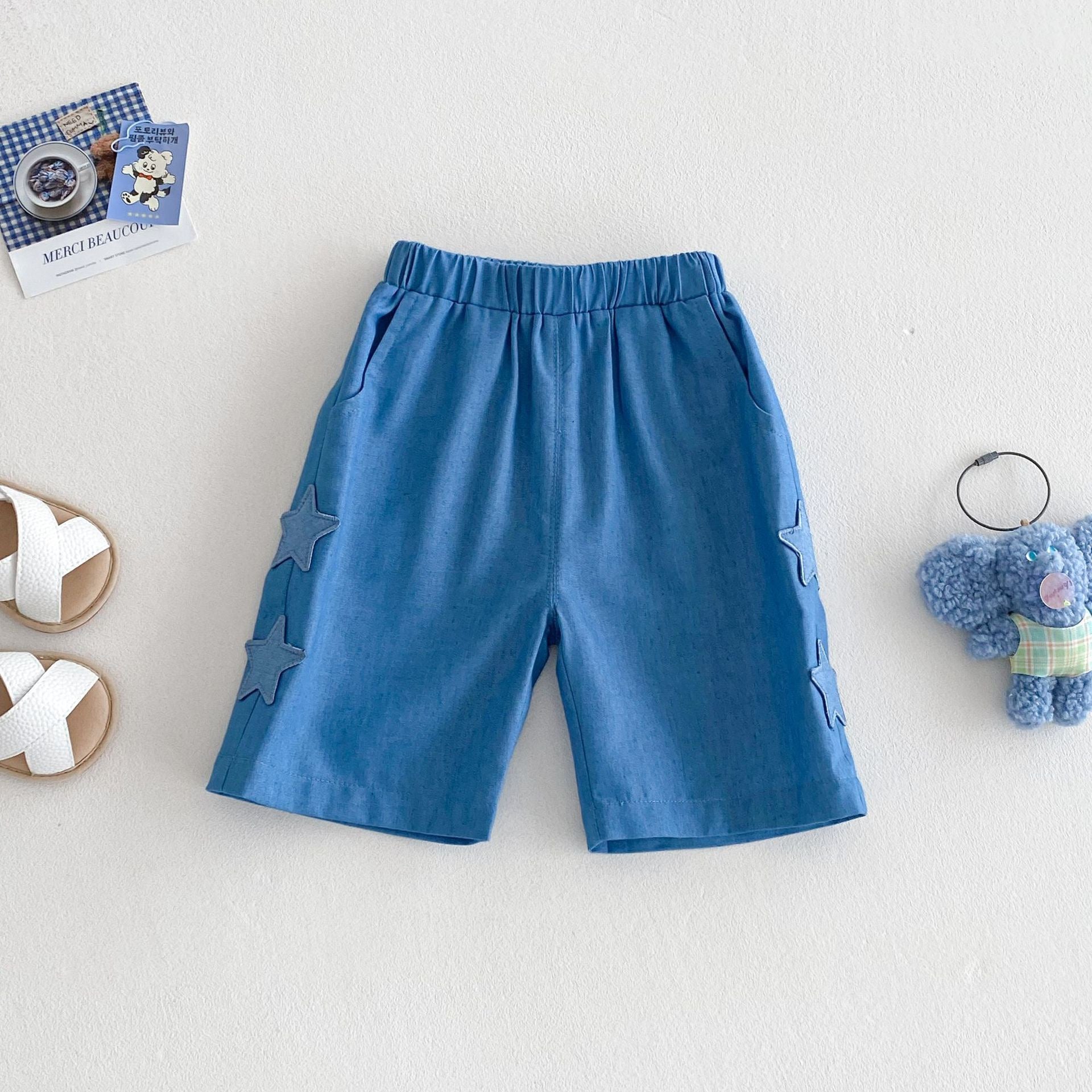 Abbigliamento estivo per bambini con design orsetto