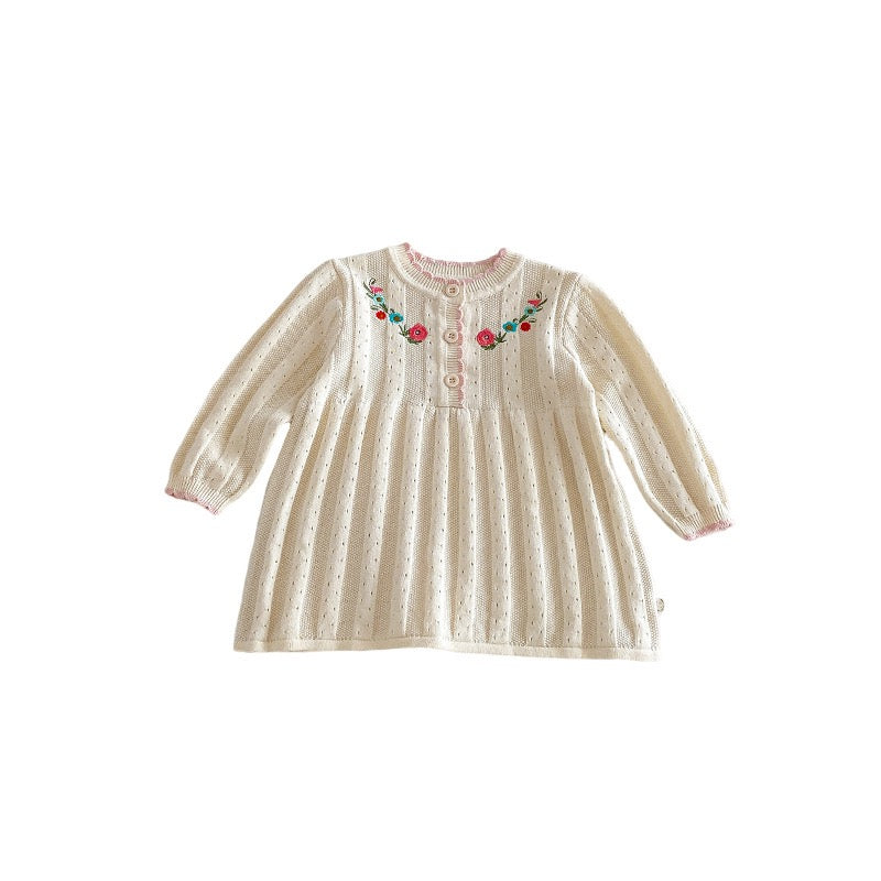 Knitted dress with embroidered flowers.