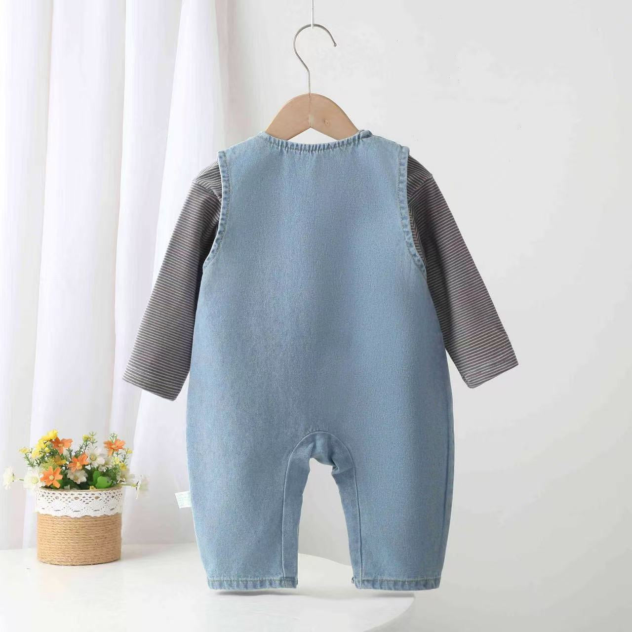 Denim overalls with teddy bear design.