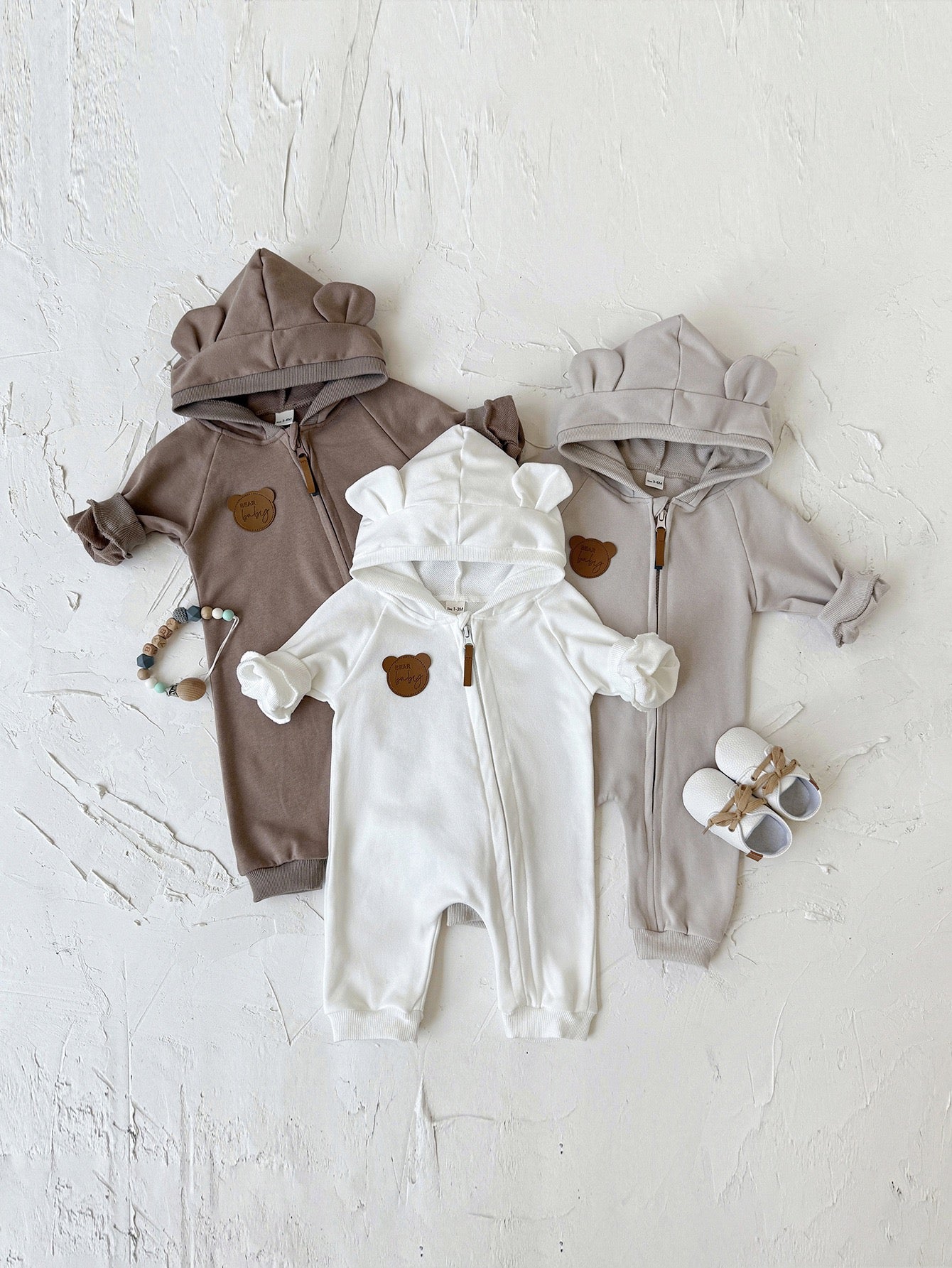 Children's jumpsuit with ears and zipper.