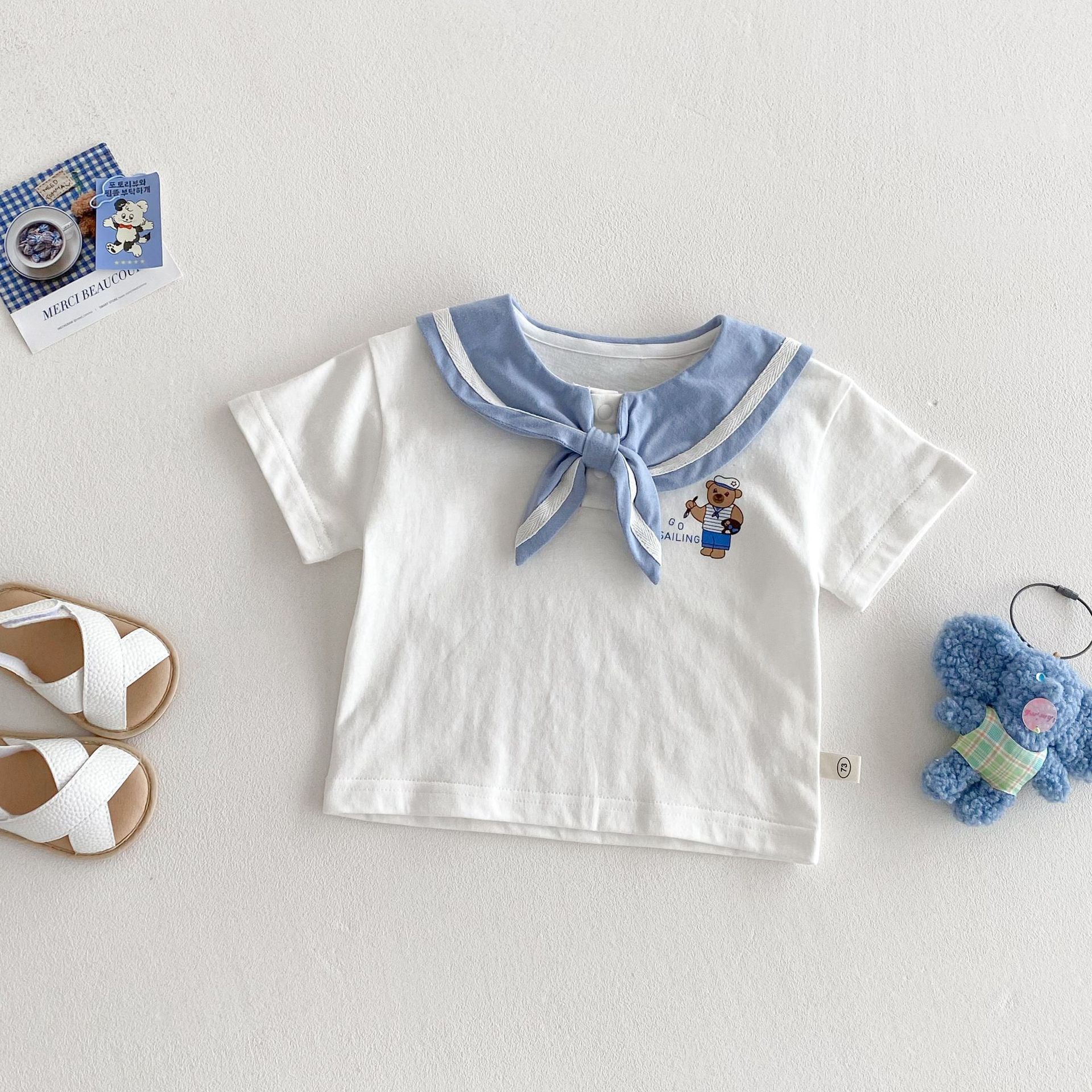 Abbigliamento estivo per bambini con design orsetto
