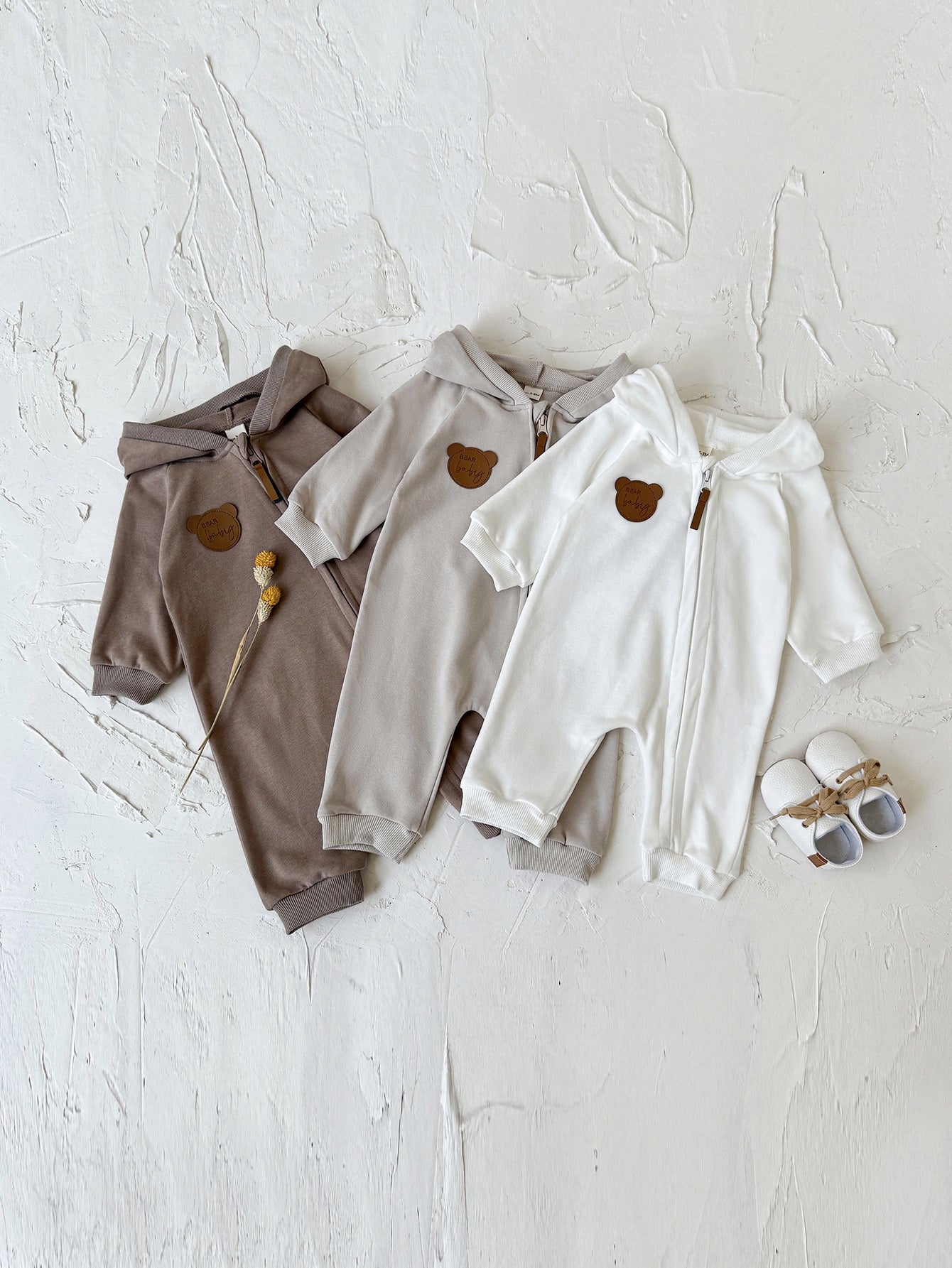 Children's jumpsuit with ears and zipper.