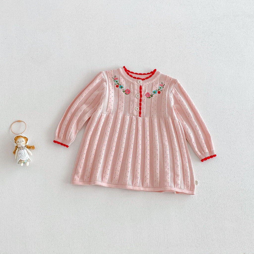 Knitted dress with embroidered flowers.