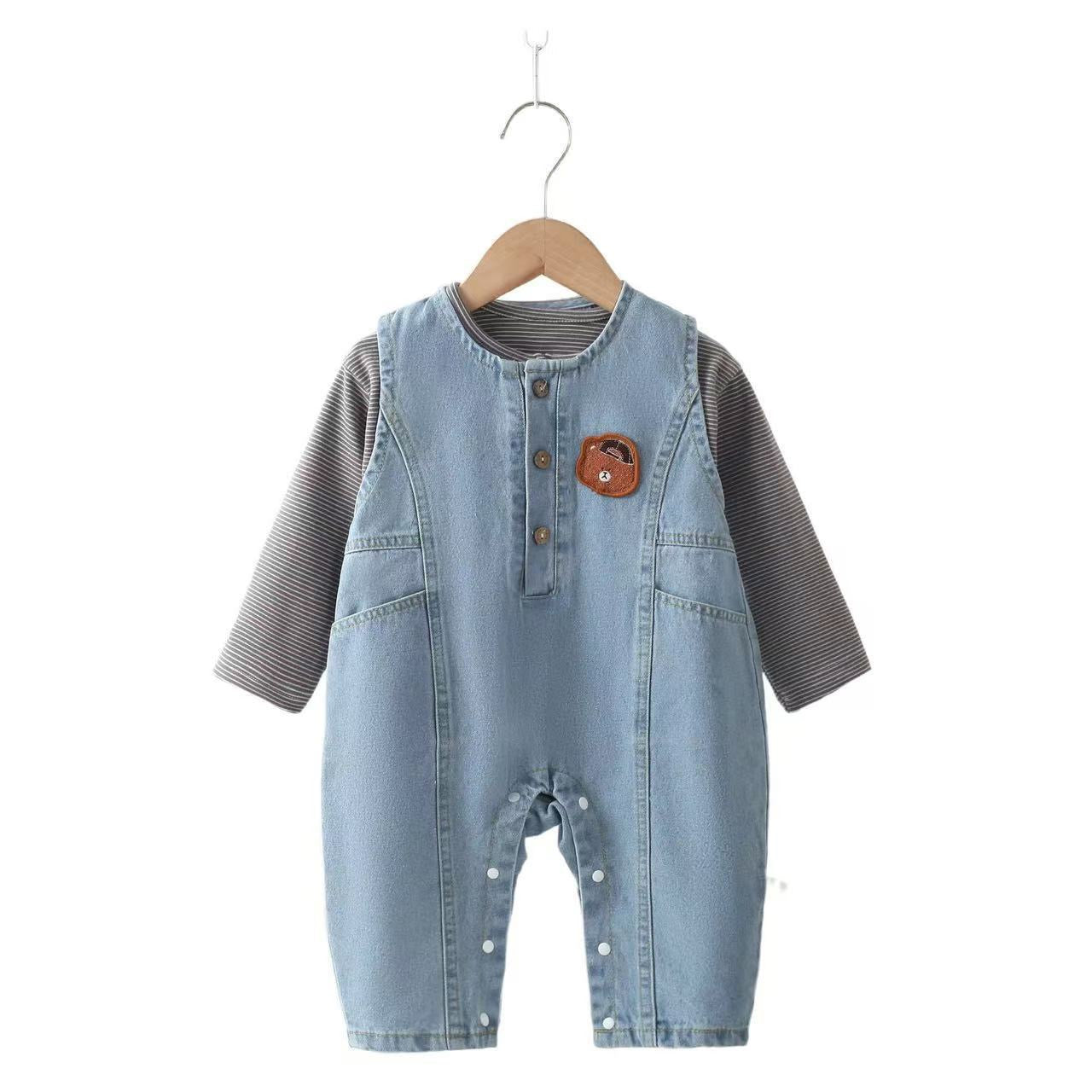 Denim overalls with teddy bear design.