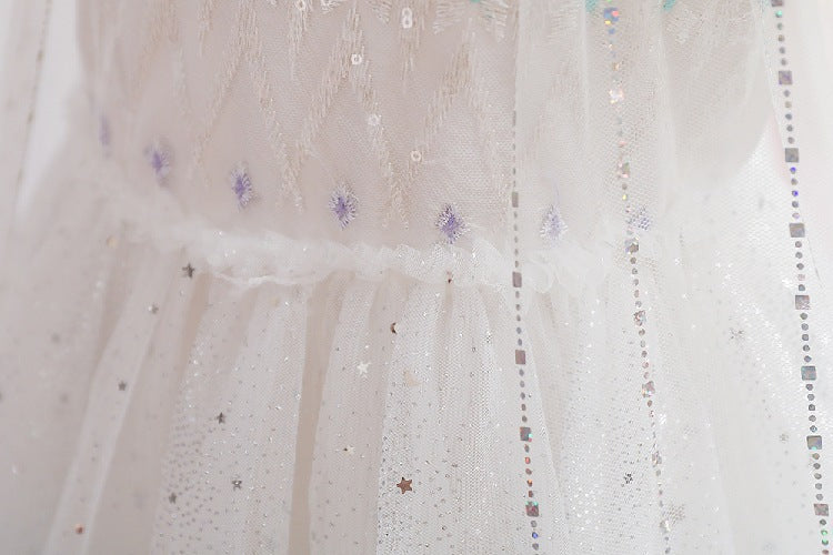 White children's dress with glitter.