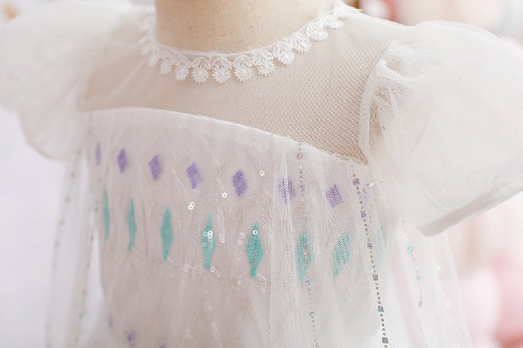 White children's dress with glitter.