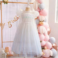 White children's dress with glitter.