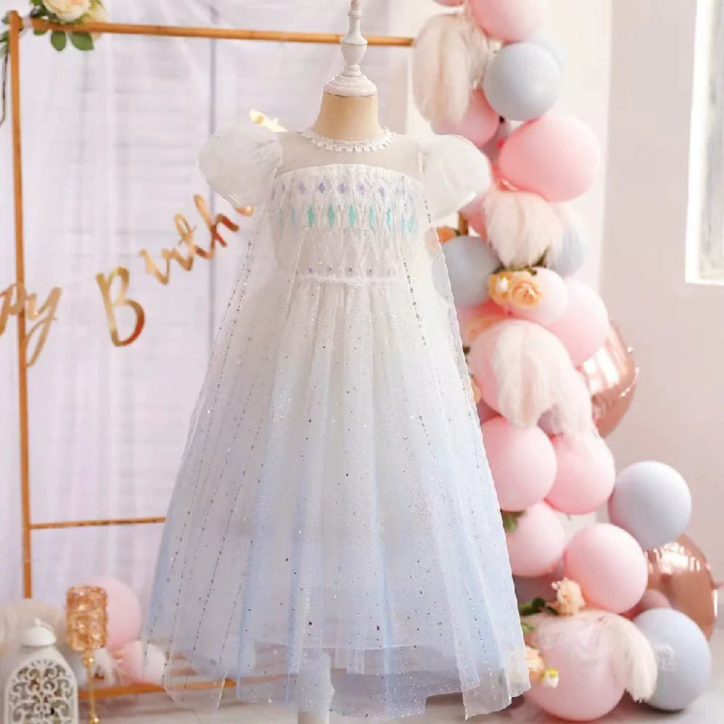 White children's dress with glitter.