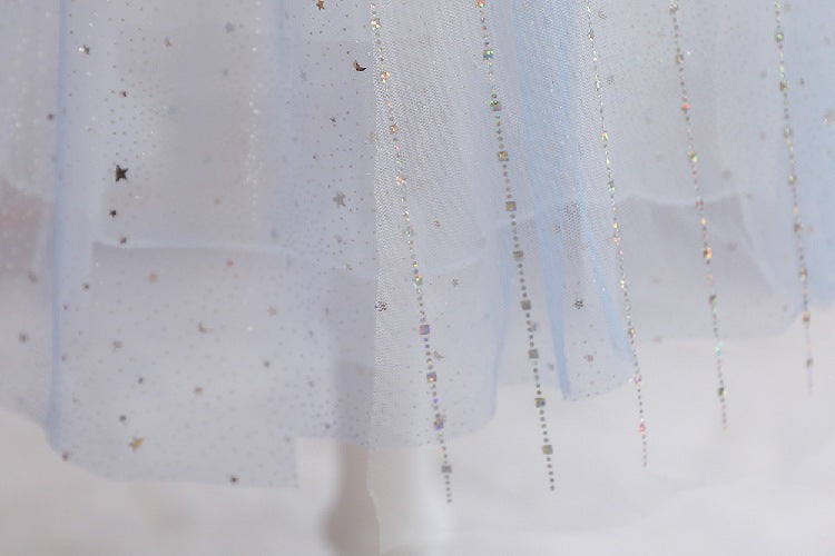 White children's dress with glitter.