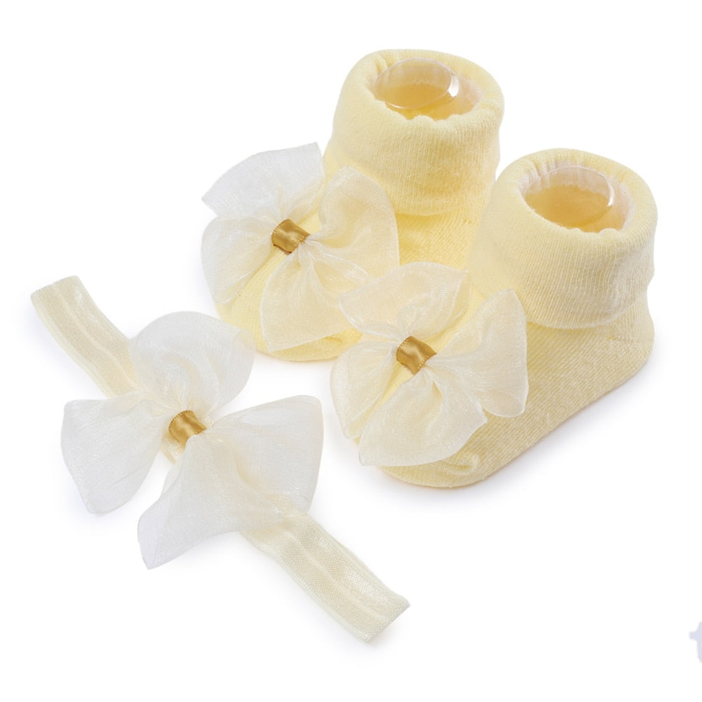 Calzino + fascia con fiocco per neonata