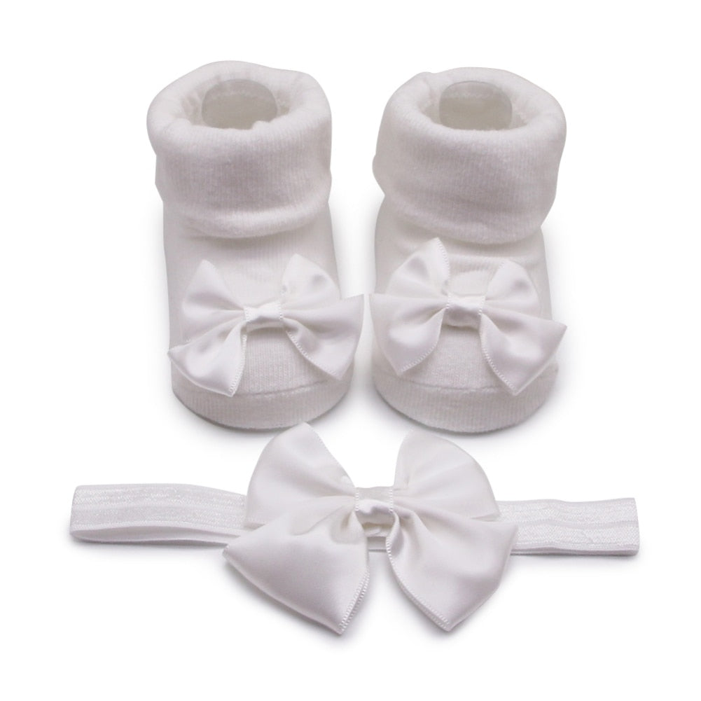 Calzino + fascia con fiocco per neonata