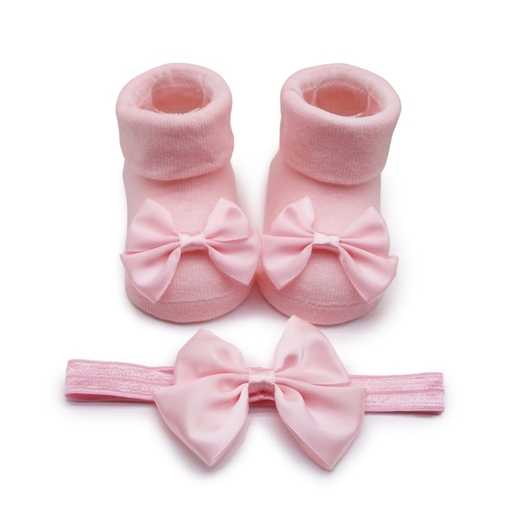 Calzino + fascia con fiocco per neonata