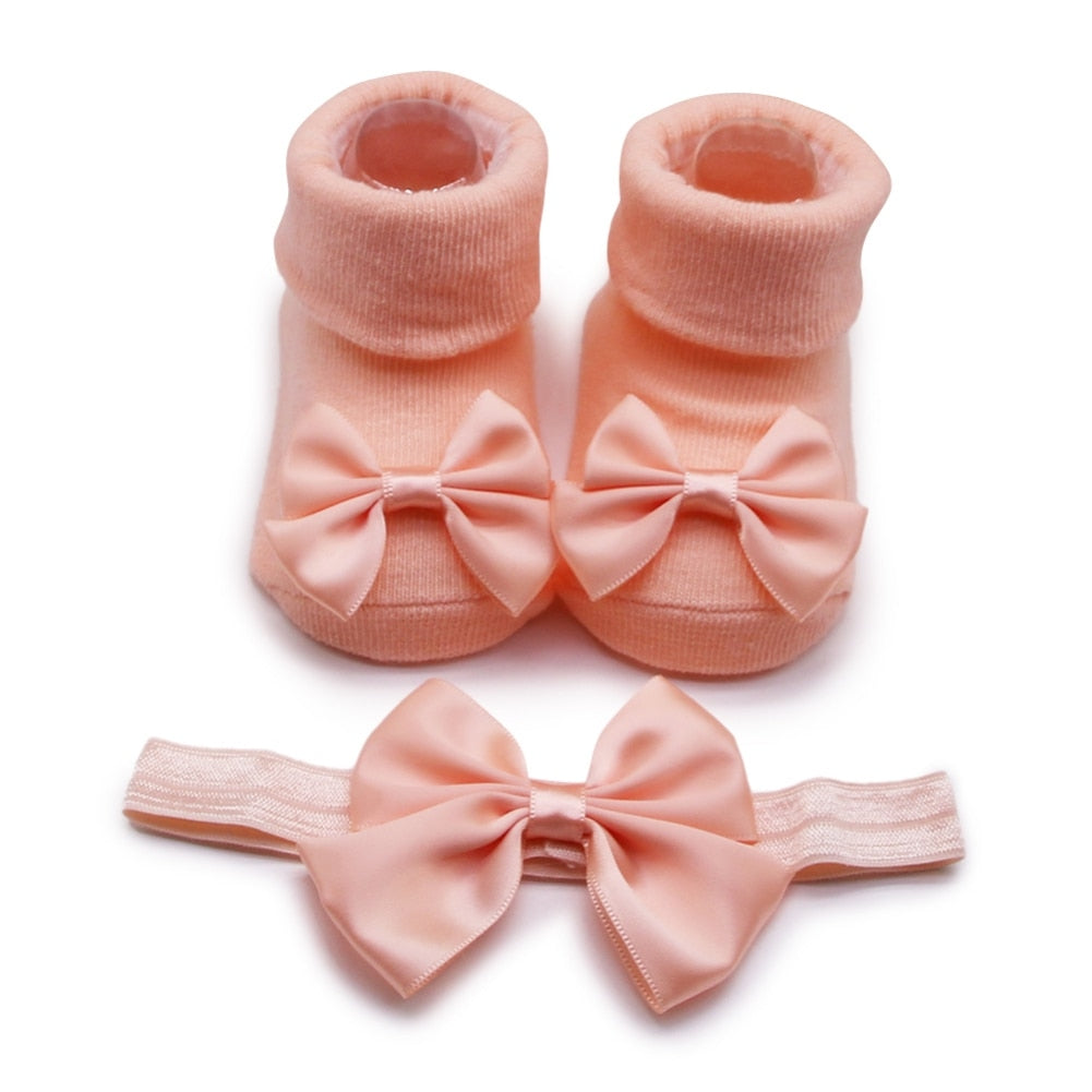 Calzino + fascia con fiocco per neonata